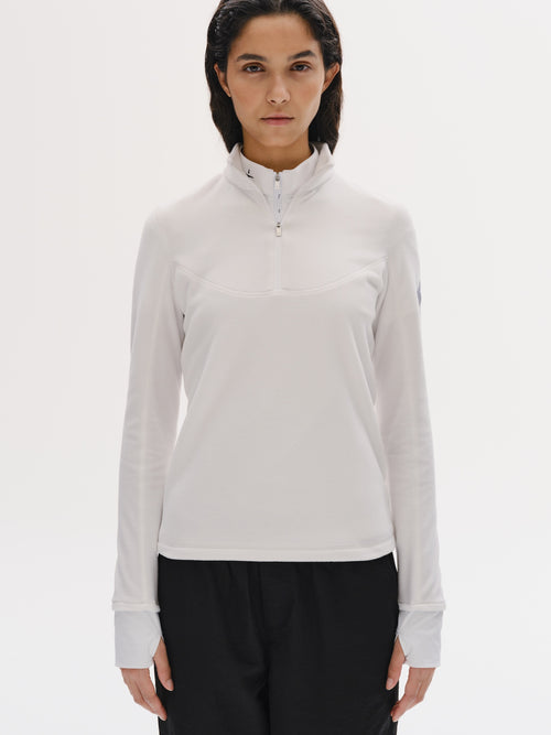Damen-Fleece-Sweatshirt mit halbem Reißverschluss, weich, atmungsaktiv, hoher Kragen, Daumenlöcher, reflektierendes Logo hinten. Perfekt für Reiten und Outdoor.