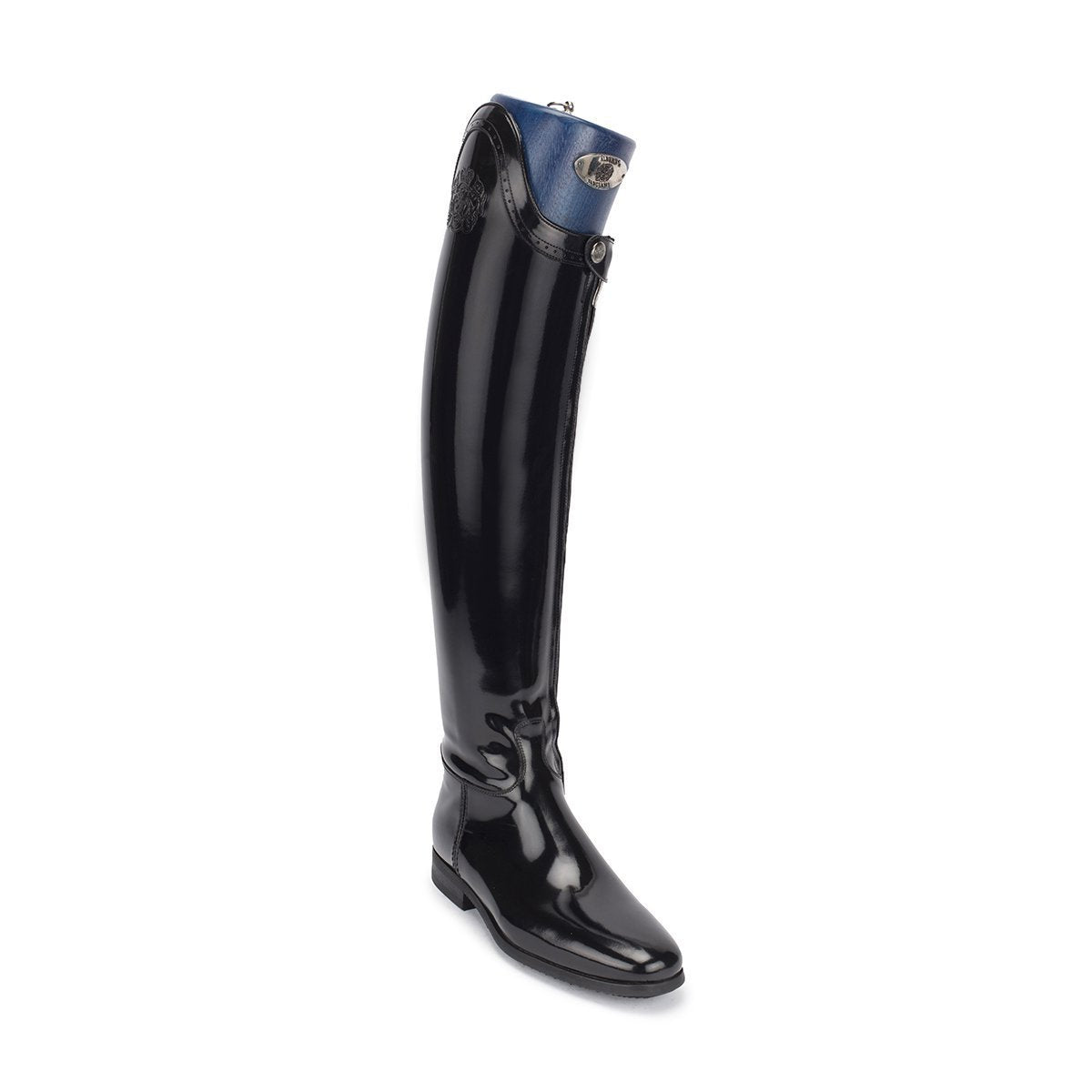 Step up your riding game with Alberto Fasciani's iconic Dressage boots! Made from glossy black calf leather and hand-polished to perfection, these boots blend elegance with comfort. And with the brand's signature logo embossed on the shaft, you're sure to turn heads in the arena. 100% Made in Italy, available in 16 different shaft sizes.